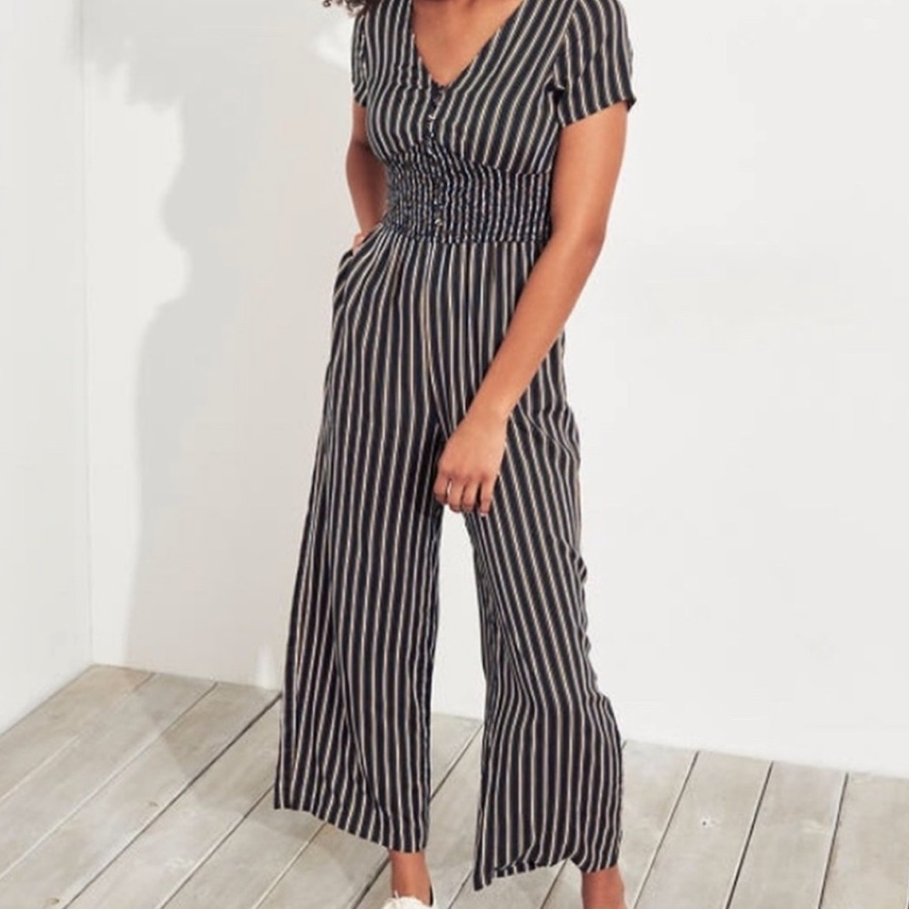 Hollister navy with white and yellow striped jumpsuit. Size small. Worn once.